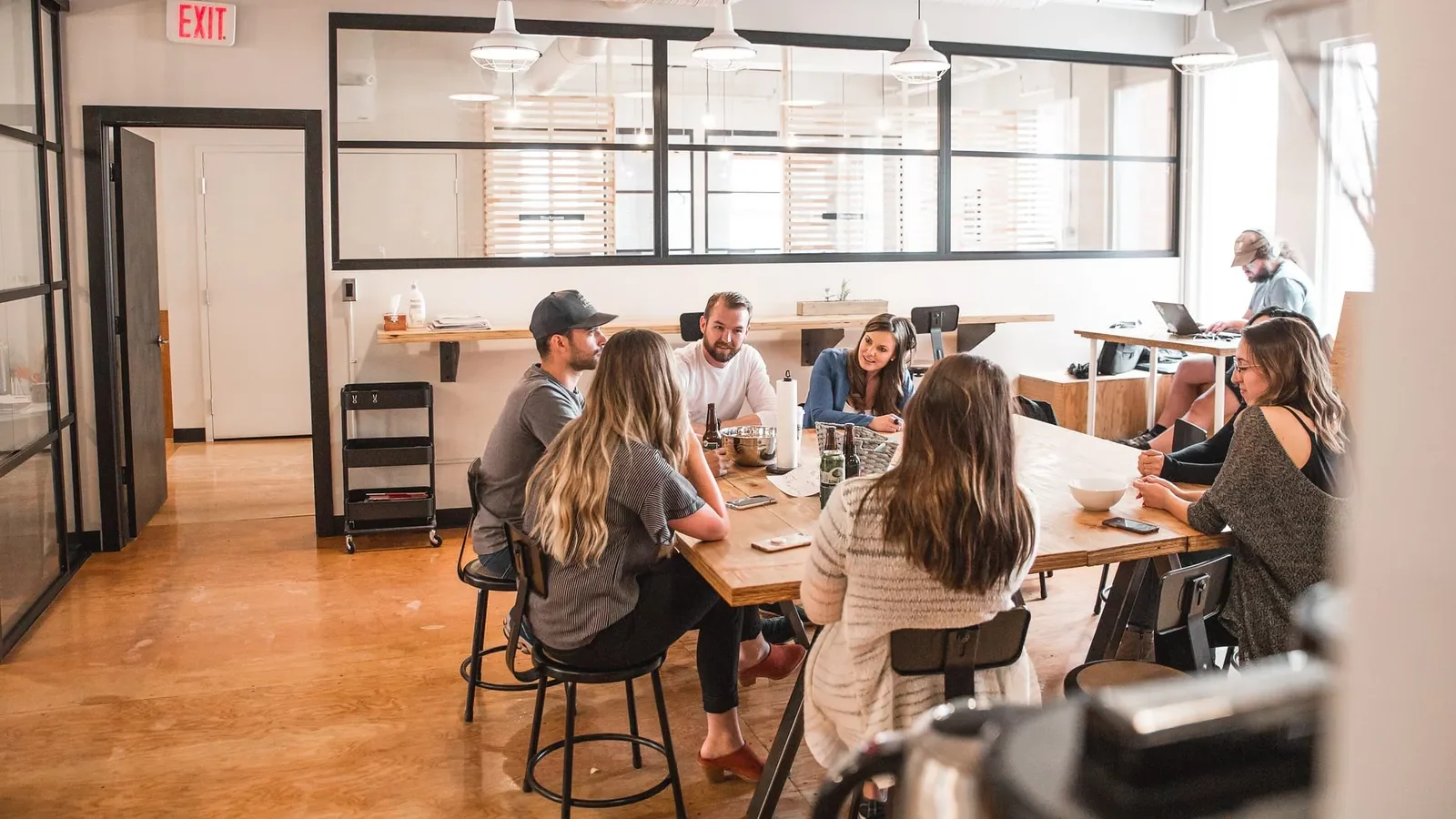 People working together at a desk in an office